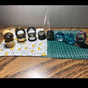 Lot of stretched ear tunnels and plugs